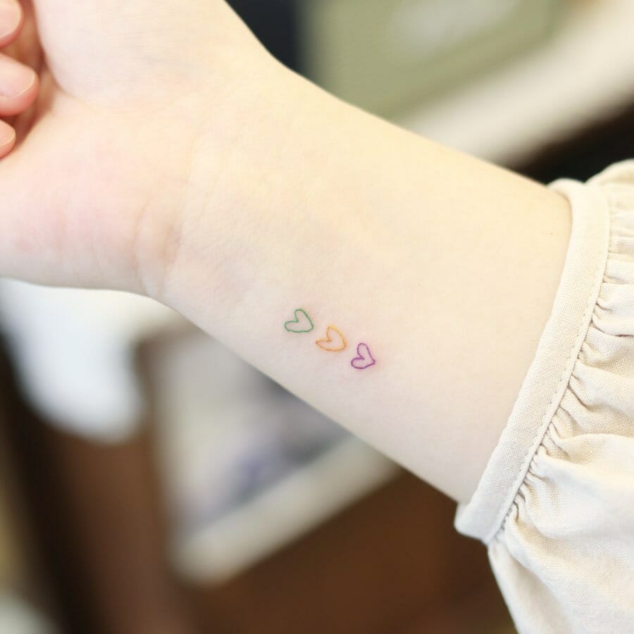 Multicolor Small Hearts Tattoos On Wrist