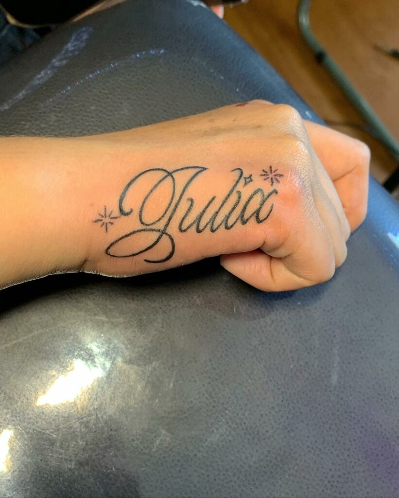 Name On Hand Tattoo