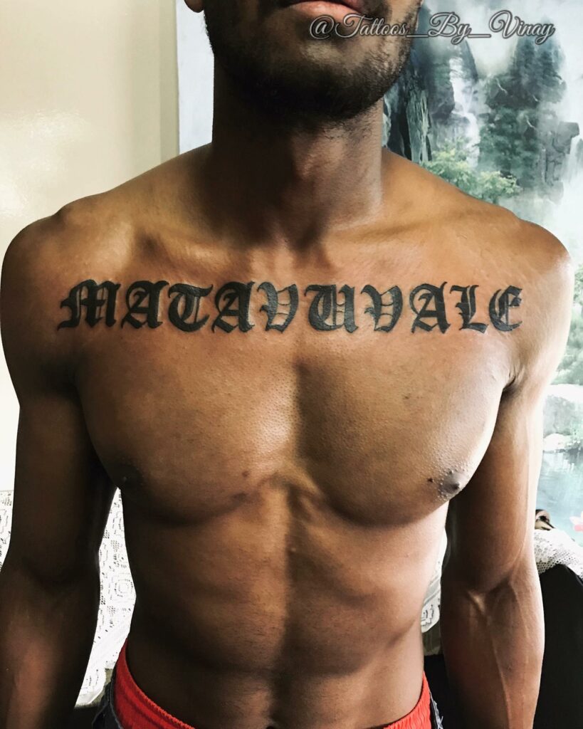 Old English Font Chest Lettering Tattoo For Mens