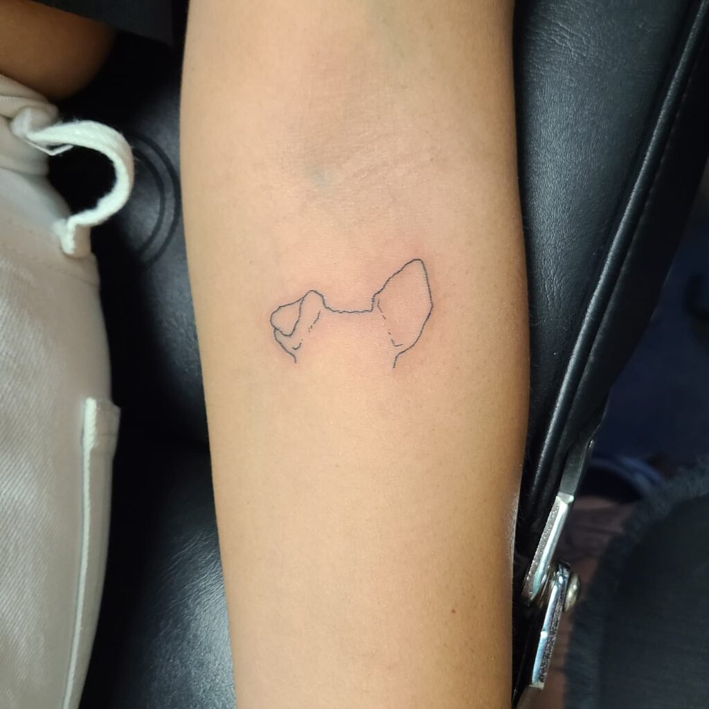 dog paw tattoo behind ear