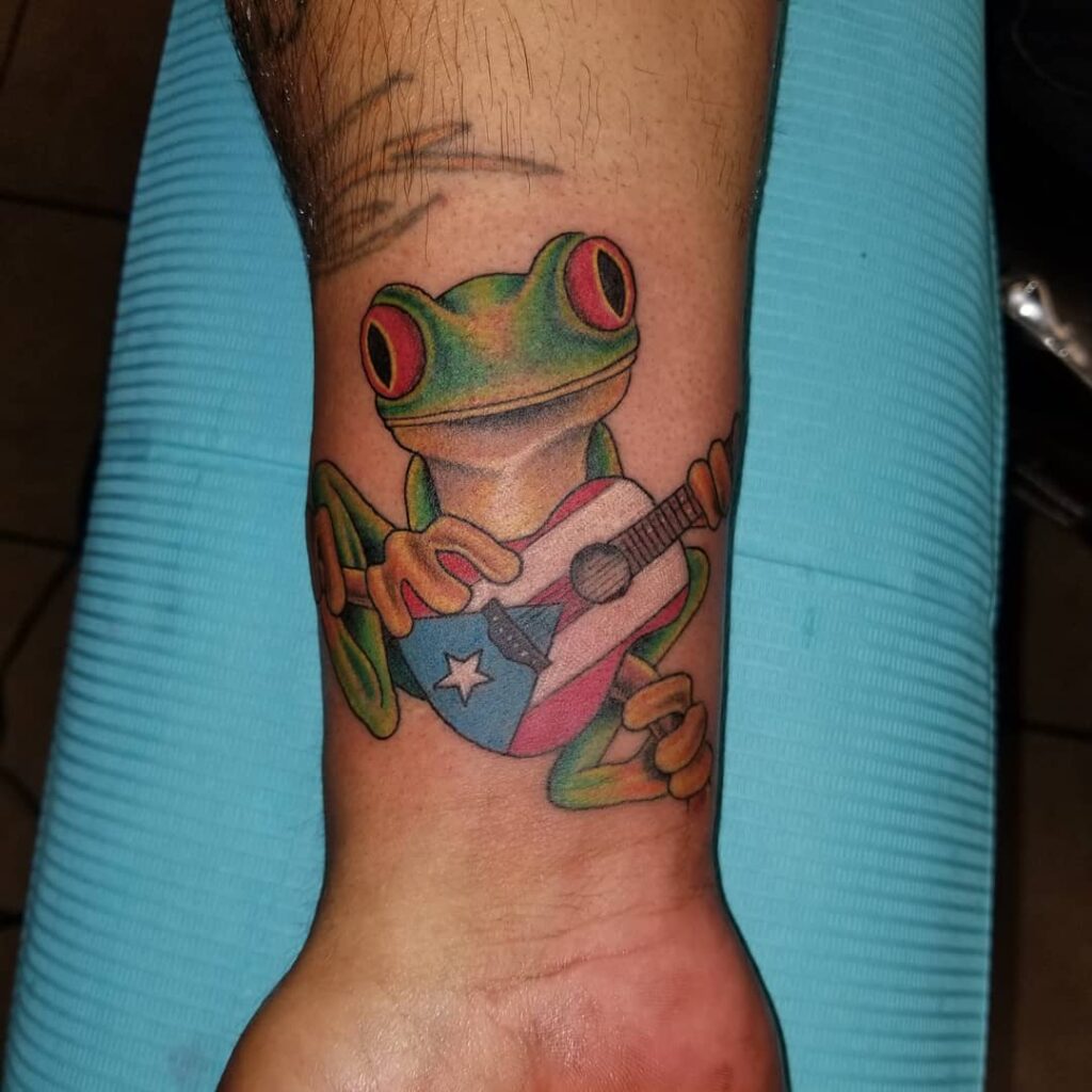 Quirky Frog Playing Puerto Rican Guitar Tattoo