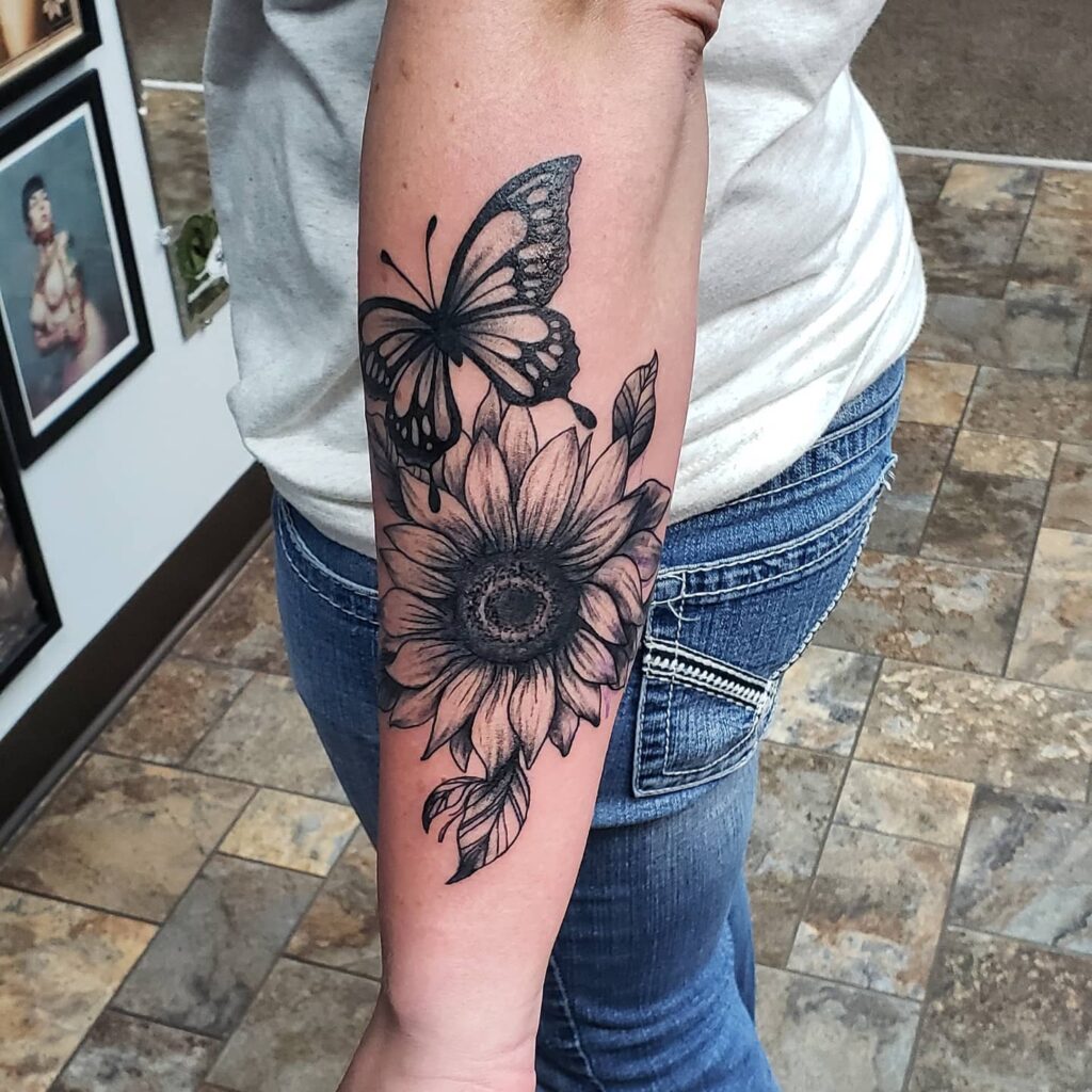 Realistic Butterfly With Flower Tattoo Idea
