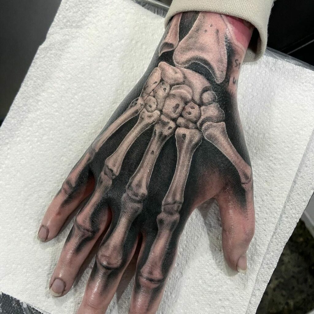 Skull hand tattoo done by Gale at chronic ink Eglinton Toronto  rtattoos