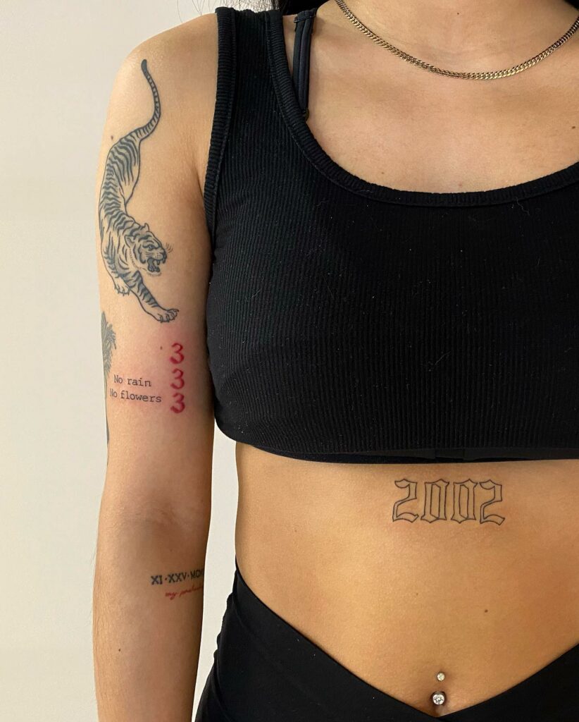 10 Birth Year Tattoo Ideas For 2024   Ribcage Birth Year Tattoo 822x1024 