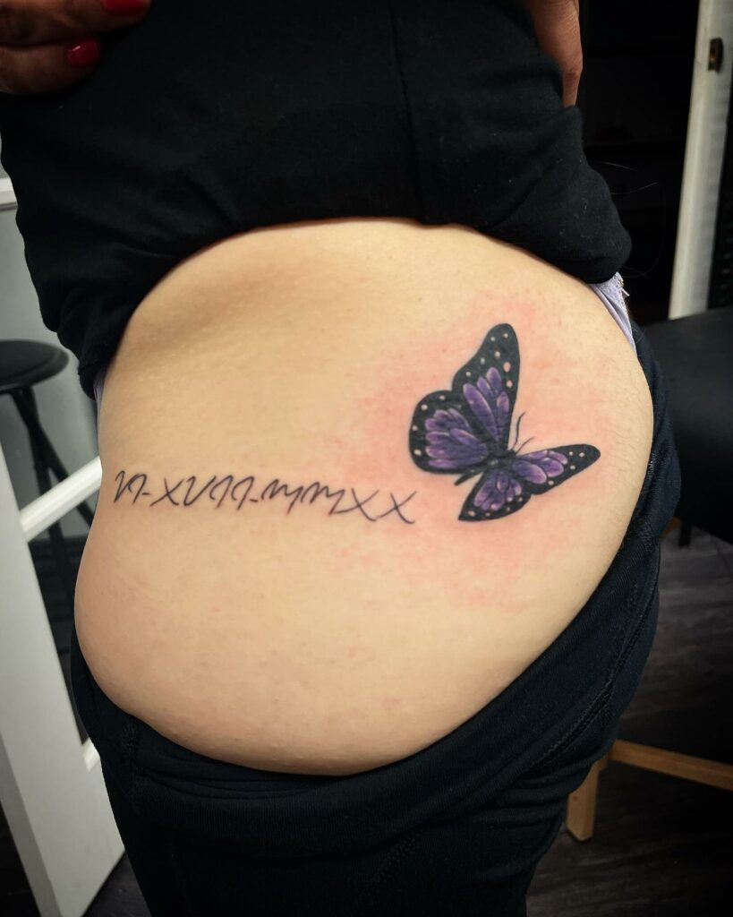 Roman Numeral Chest Tattoo With A Butterfly