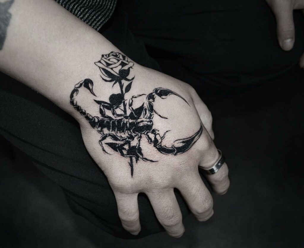 Rose And Tiny Scorpion Tattoo