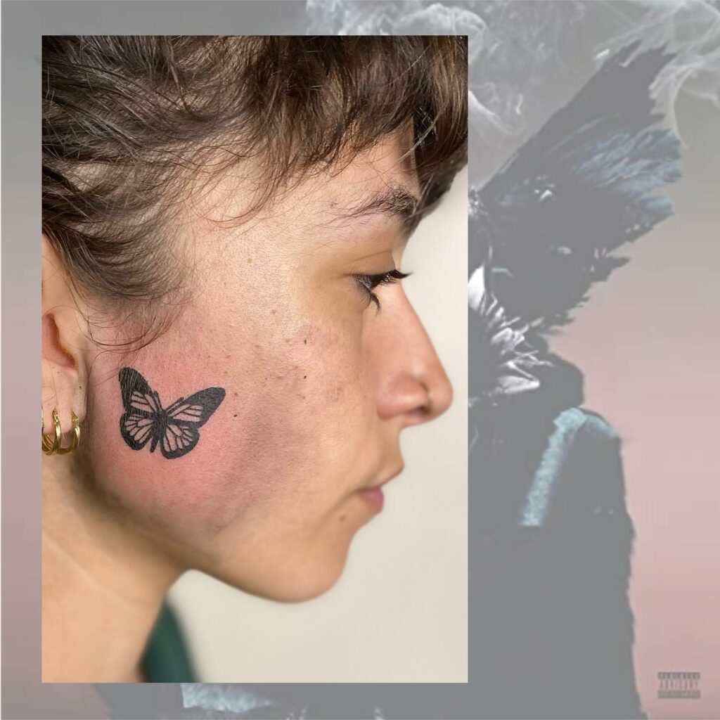 Simple Butterfly Face Tattoo