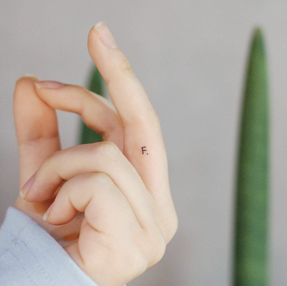 Simple Lettering Initial Tattoo on Finger
