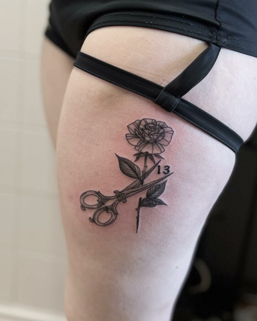 Simple Rose Tattoo On Thigh With Stems Getting Cut