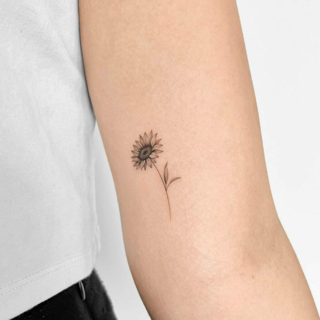 Beautiful black and white sunflower tattoo on the back of arm  Tattoos  Arm tattoos for women Sleeve tattoos