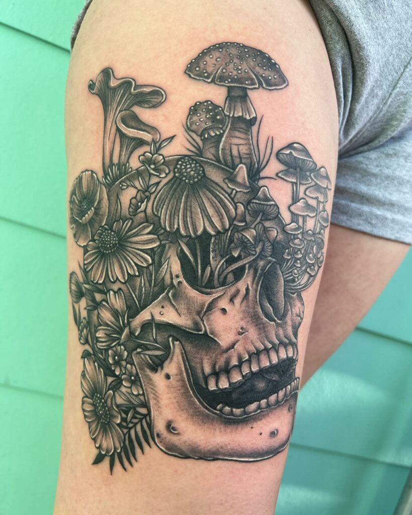 Skull And Flower Inner Thigh Tattoo Designs