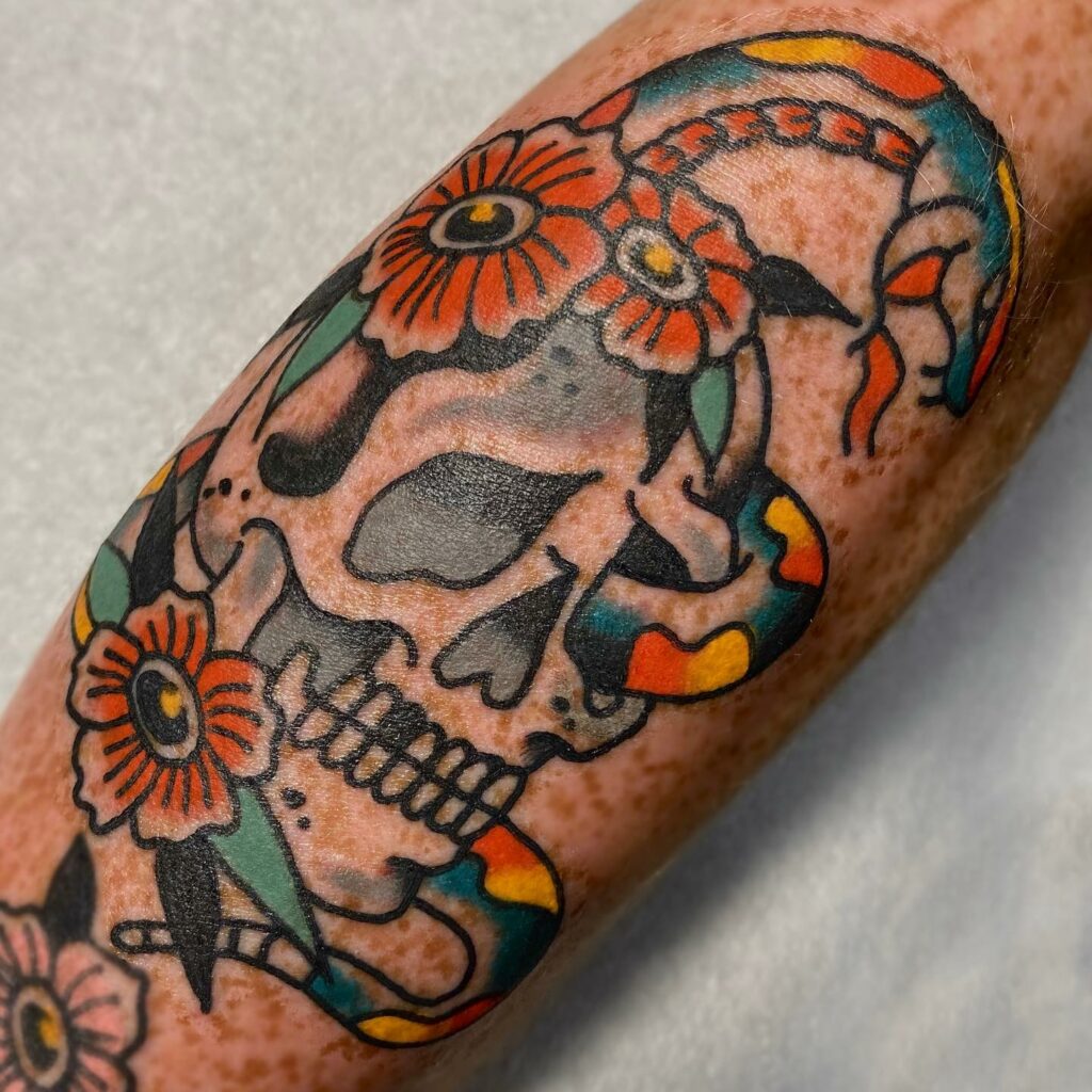 Skull And Snake Face Tattoo