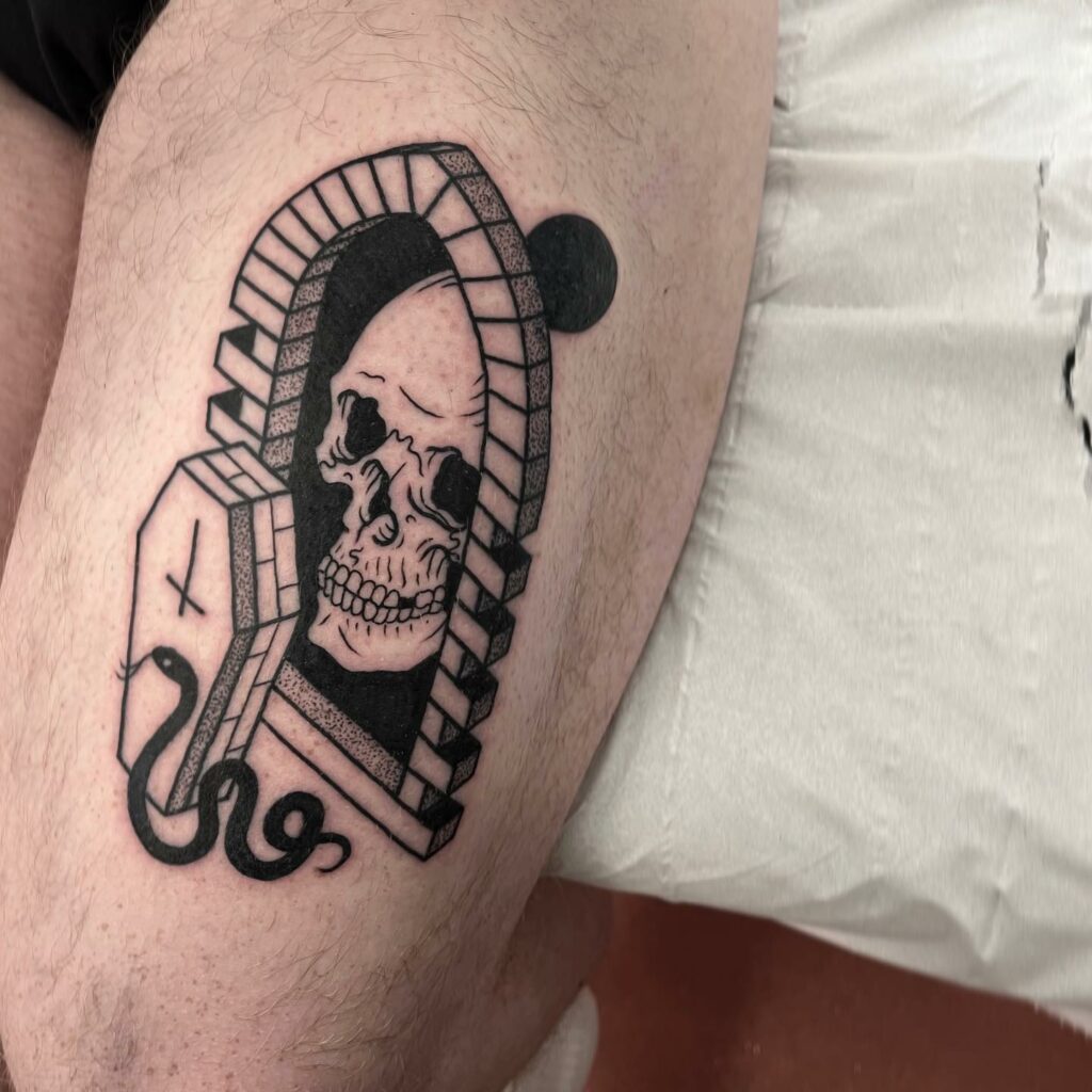 Skull And Snake Tattoo