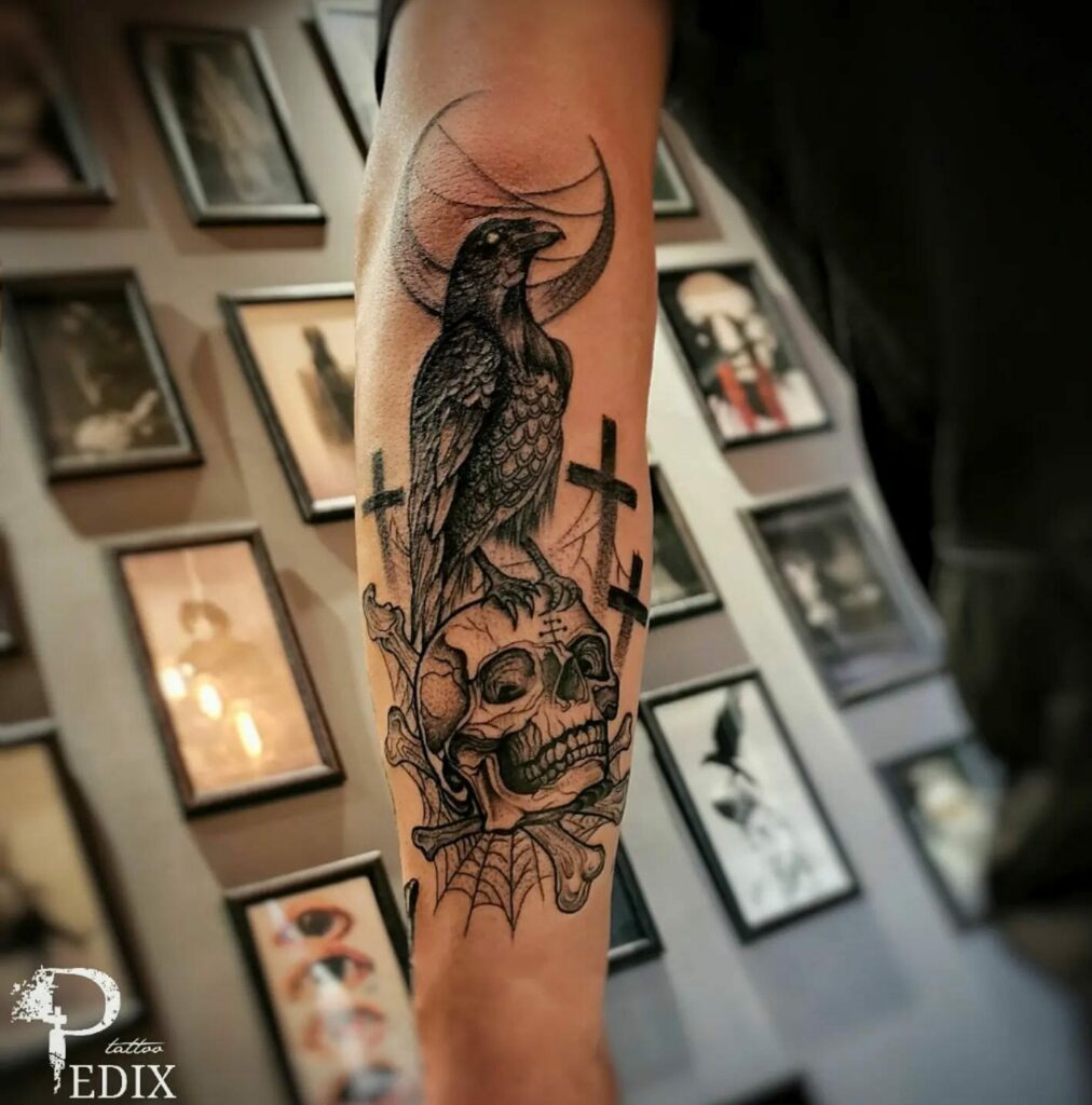 Skull Back Of Bicep Tattoo