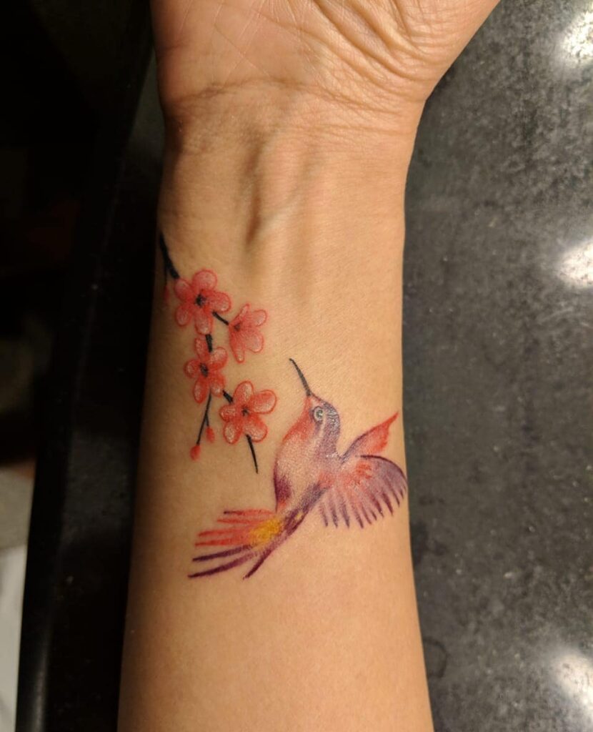 Small Hummingbird With Flowers Tattoos