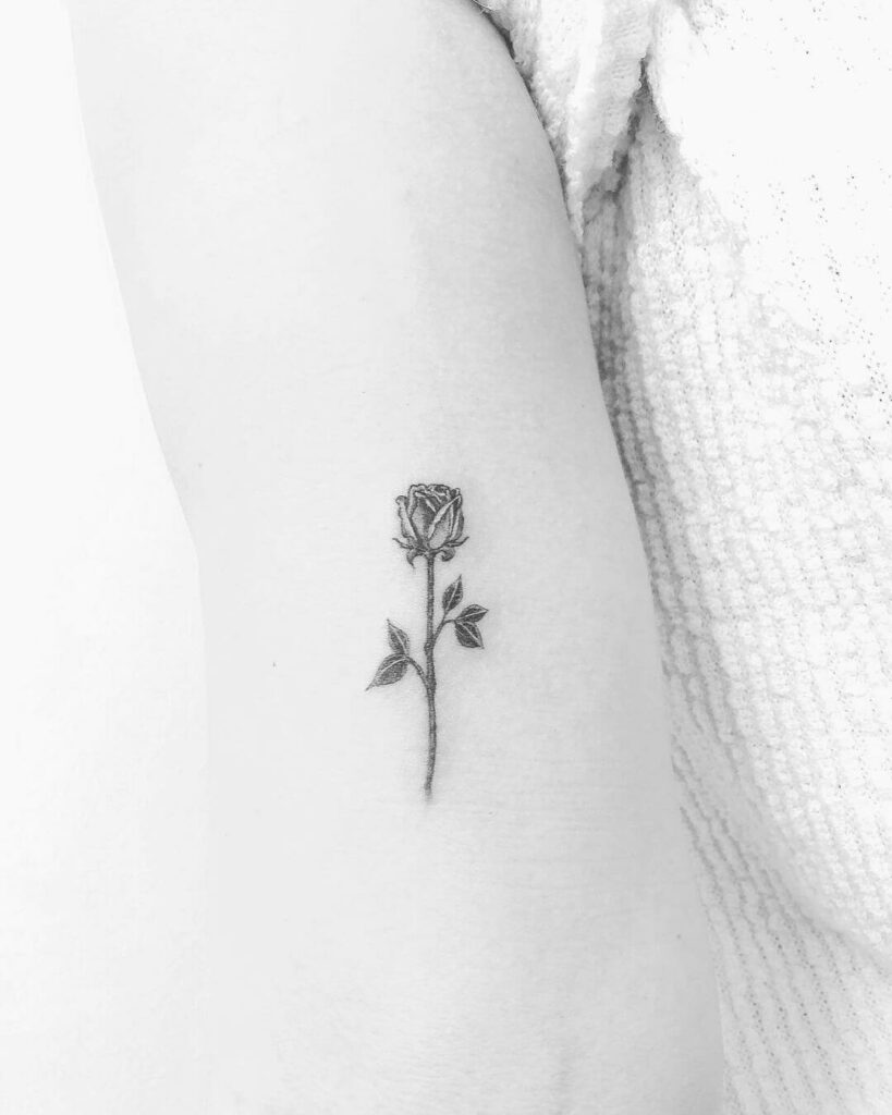 Small Rose On Hand Tattoo