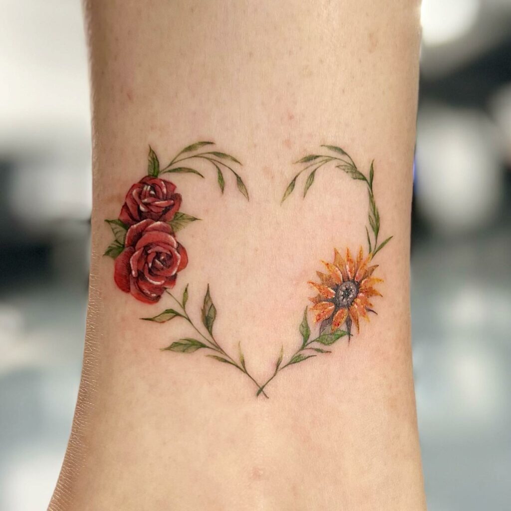 Small Roses And Realistic Sunflower Tattoo