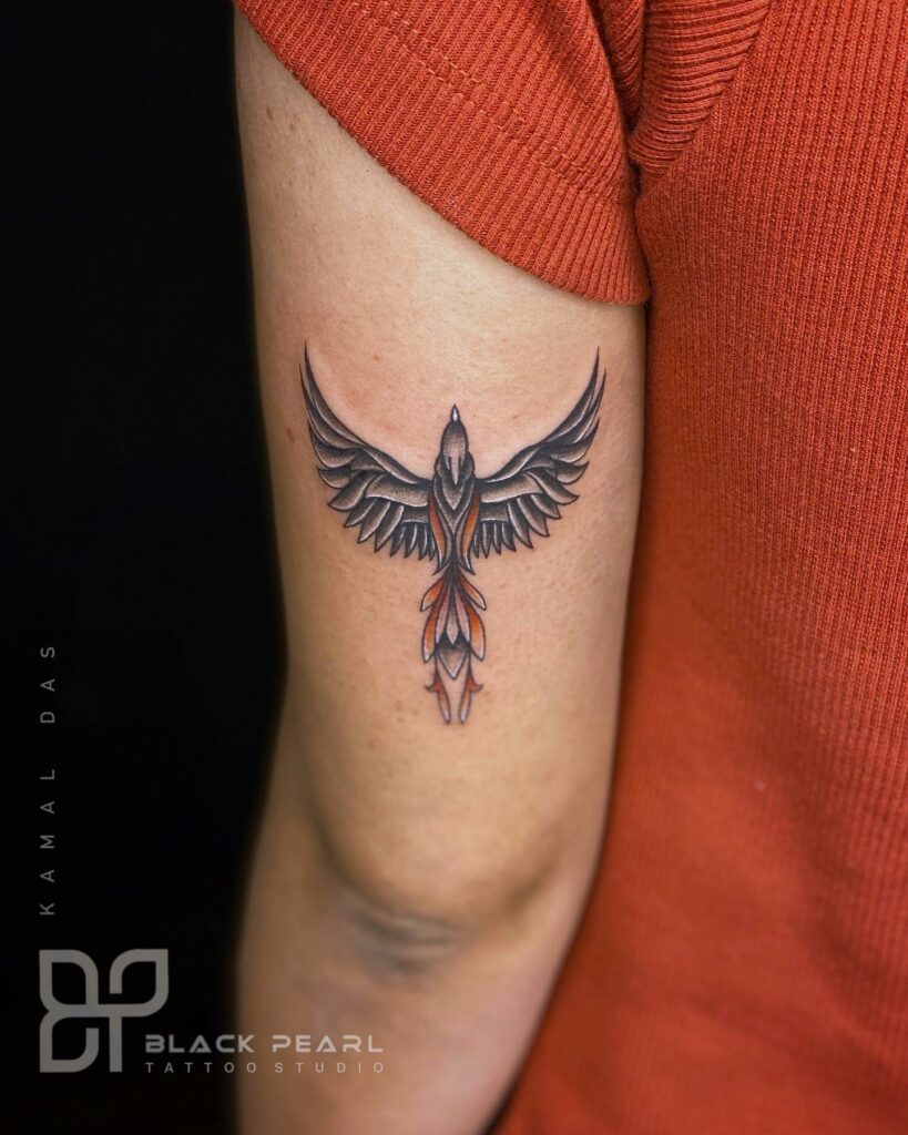 Small Upper Arm Phoenix Tattoo