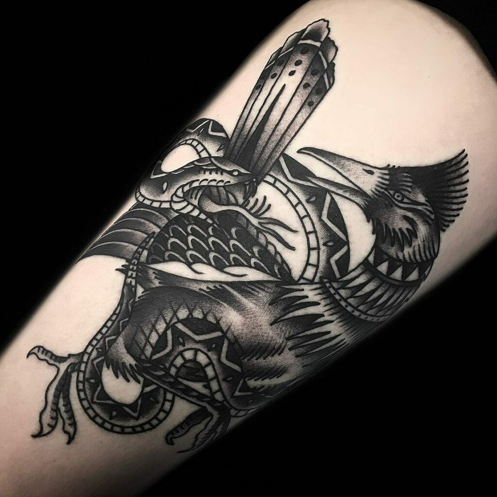 Snake And Roadrunner Fight Tattoo