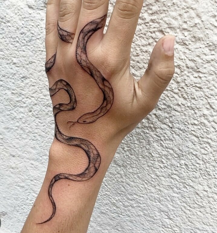 Snake Wrapped Around Finger Tattoo