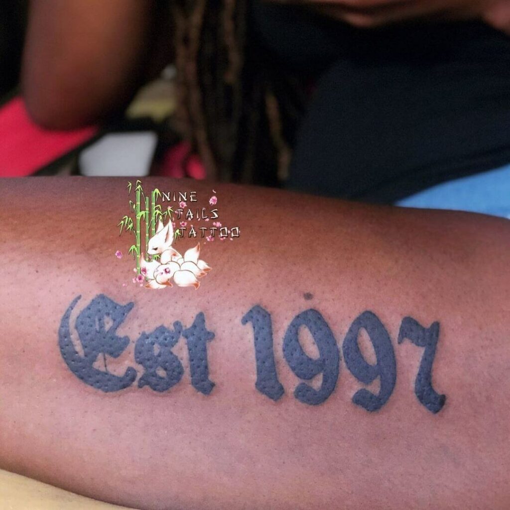 11 Est 1997 Tattoo Ideas That Will Blow Your Mind   Solid 1997 Est Tattoo On Forearm 1 1024x1024 