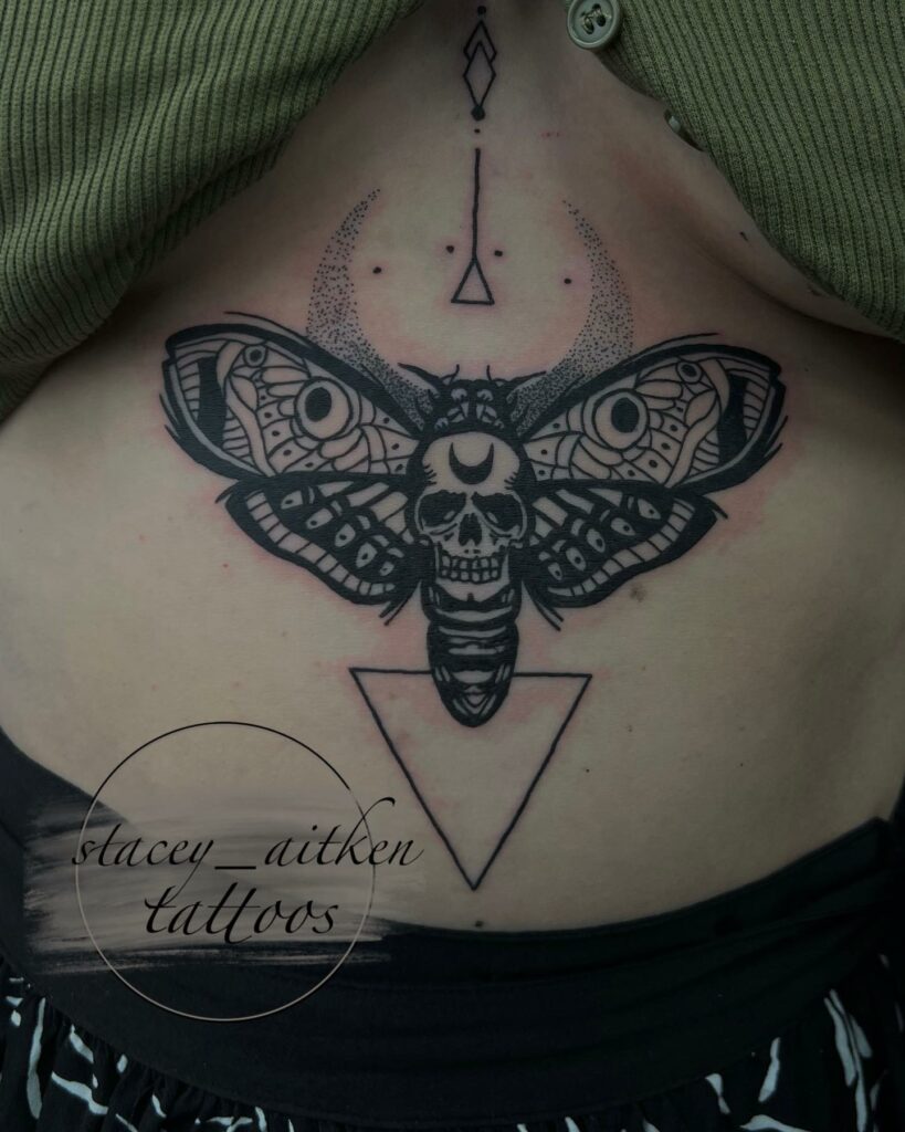 Sternum Tattoo Of Butterfly And Skull Tattoos