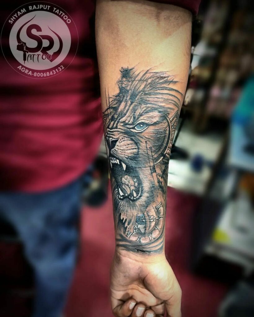 Stunning Black And Gray Lion Face Tattoo On Forearm