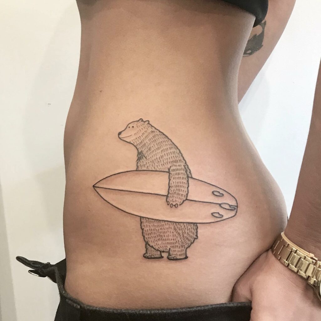 Minimalist polar bear tattoo on the inner arm