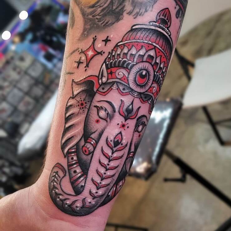 The Black And Red Lord Ganesha Tattoo
