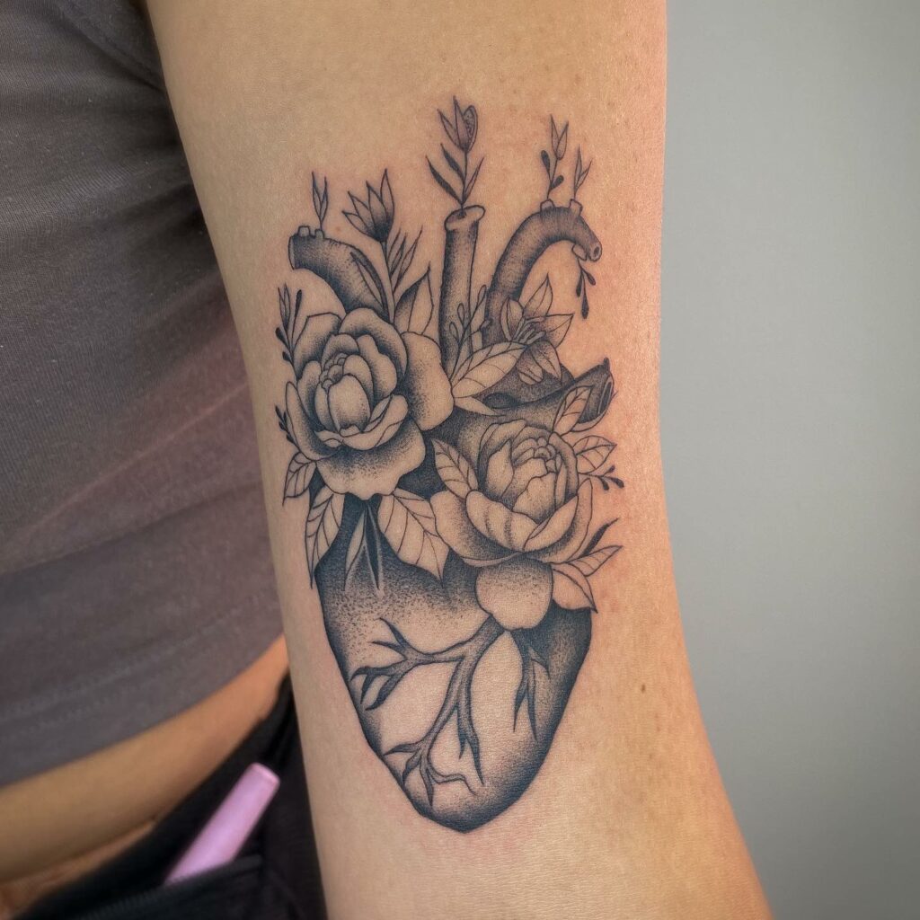 The Flowers Growing On Heart Tattoo