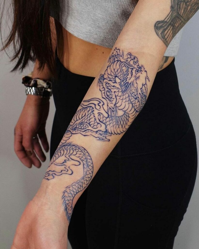 The Girl With The Dragon Forearm Tattoo
