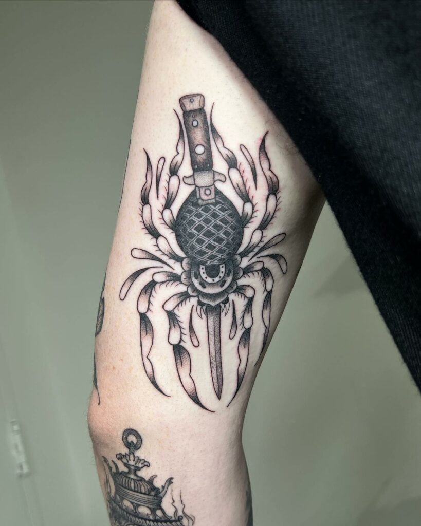 The Traditional Black Widow and Dagger Tattoo