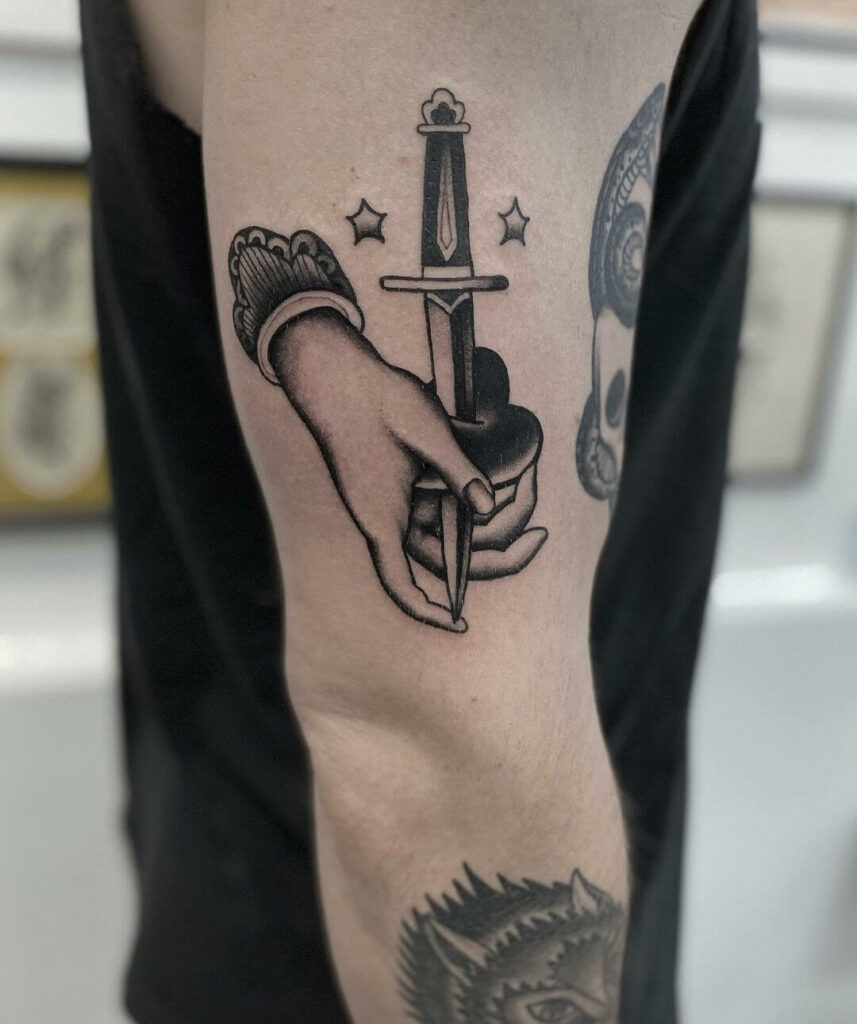 The Traditional Heart And Knife Tattoo