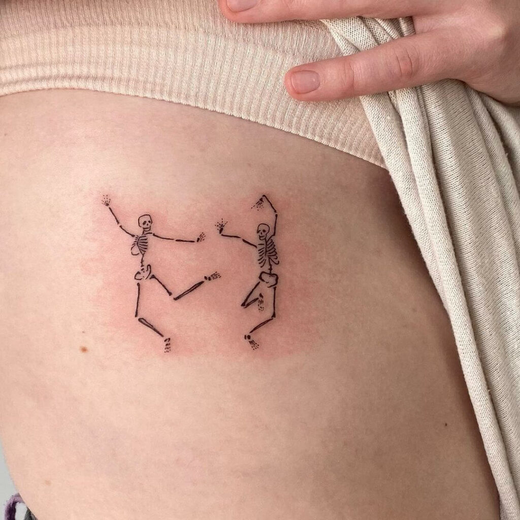 Tiny Dancing Skeleton Tattoo