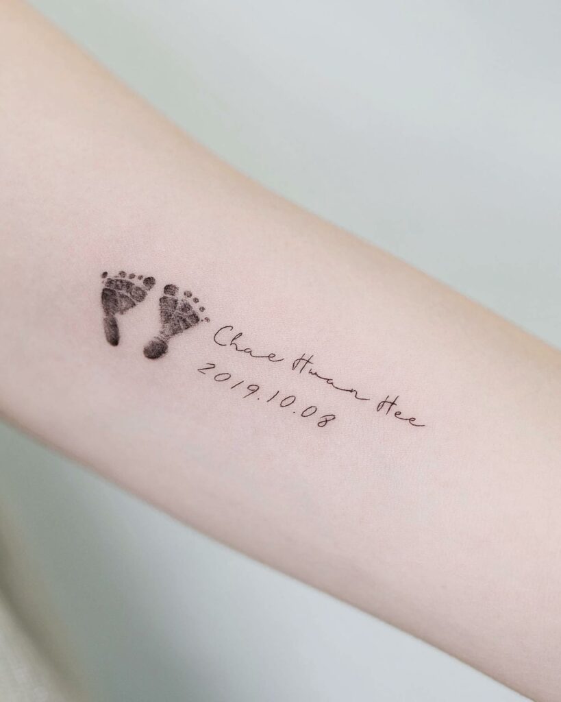Tiny Footprints With Baby's Name Tattoo Ideas