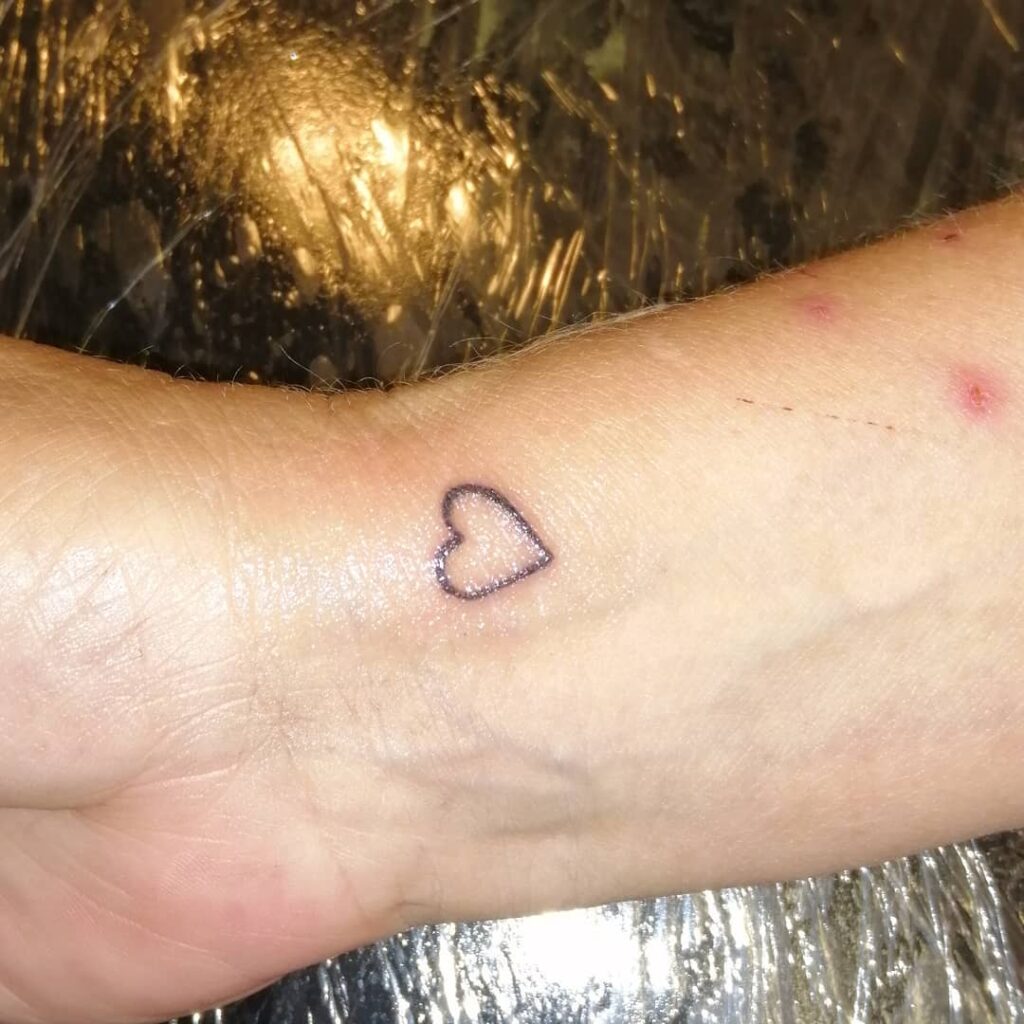 Tiny Heart Tattoo On Wrist