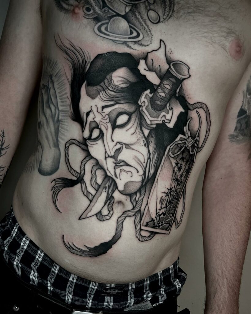 Tribal Japanese Stomach Tattoo
