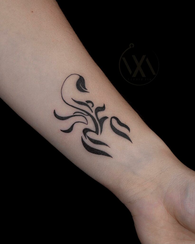 Fine line scorpion tattoo located on the inner arm