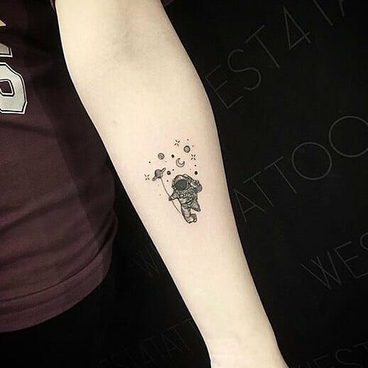 Very Cute Astronaut And Planets Small Galaxy Tattoo