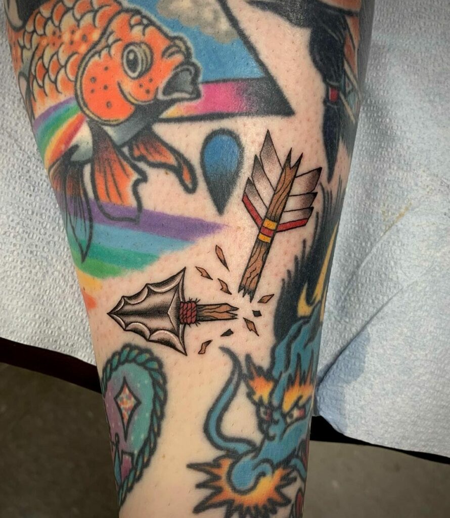Vibrant Broken Arrow Tattoo