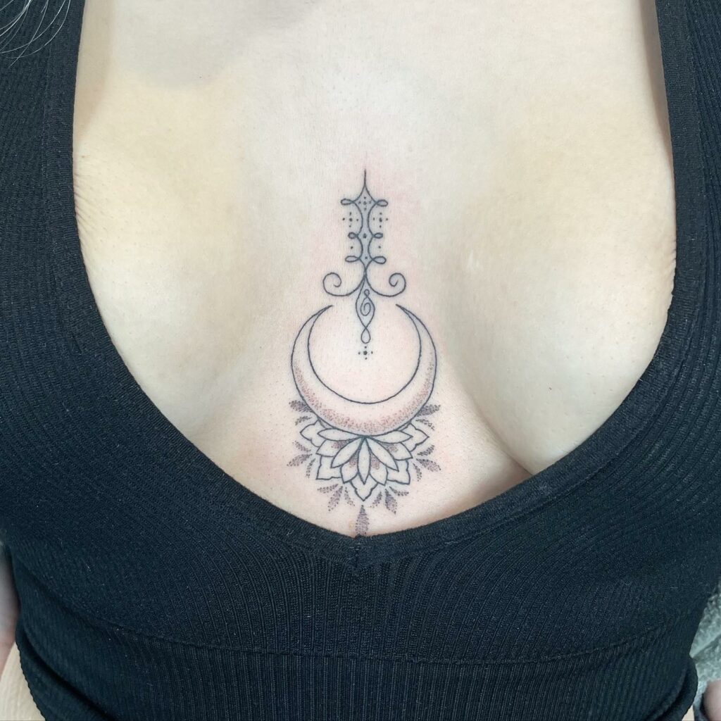 Wonderful Sternum Tattoo Design With Sun And Moon Motif ideas