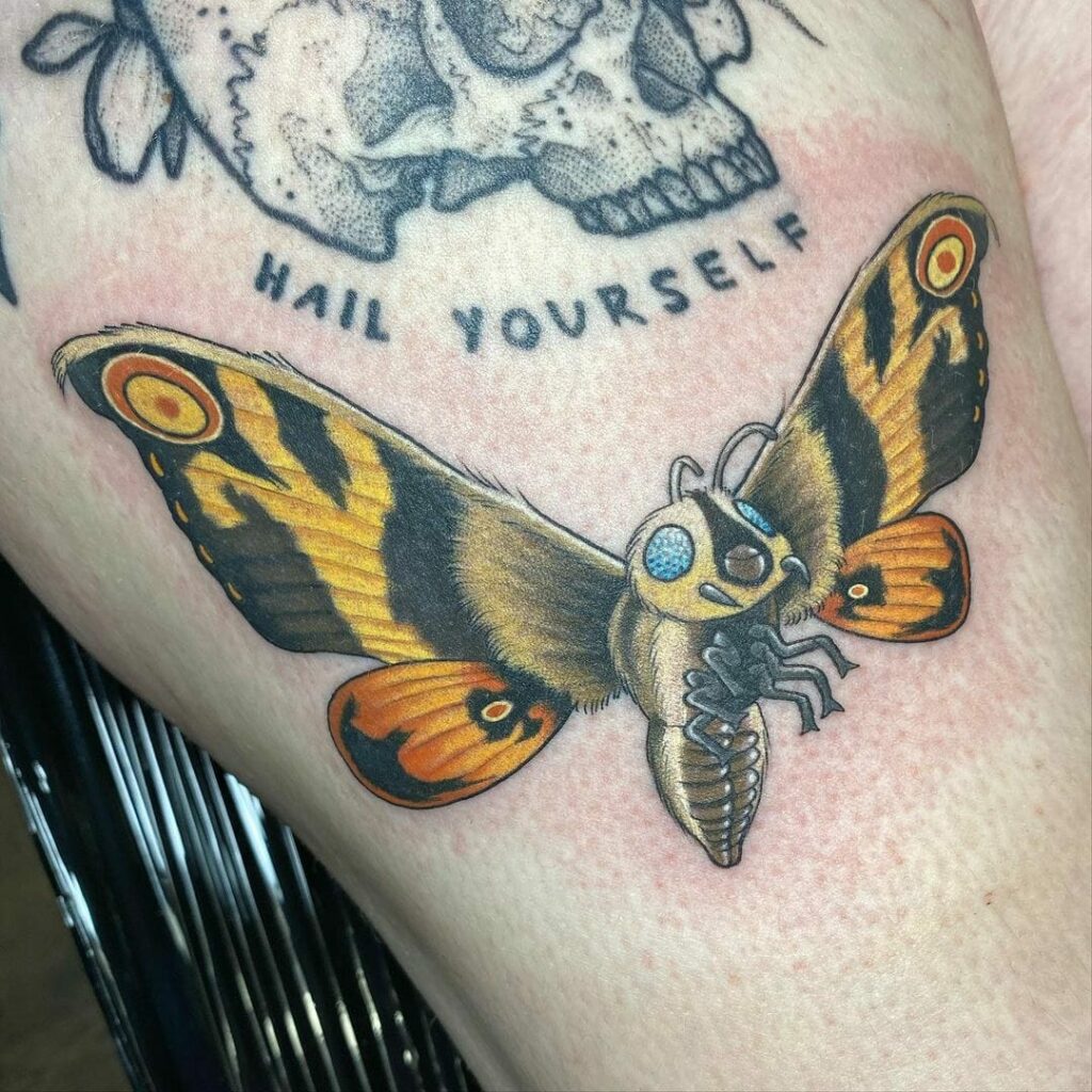 Yellow And Black Mothra Tattoo