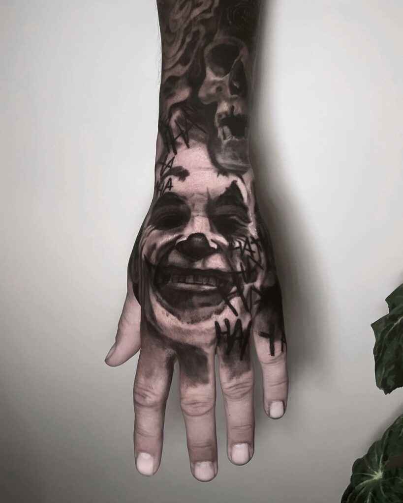 Joker Smile Hand Tattoo