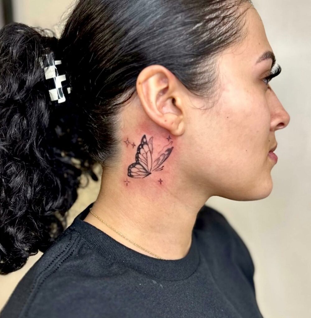 Butterfly neck tattoo