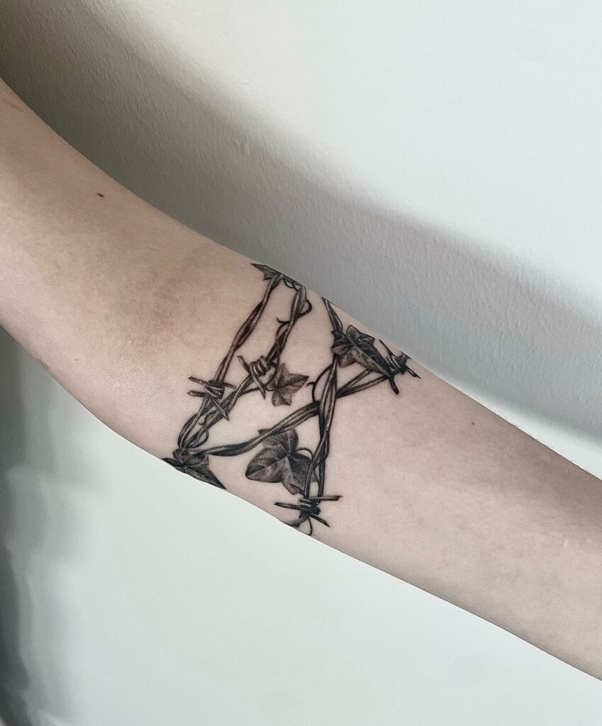 Barbed wire arm tattoo