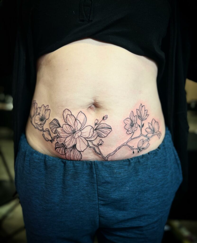 Tattoo of Stretch marks Flowers Belly