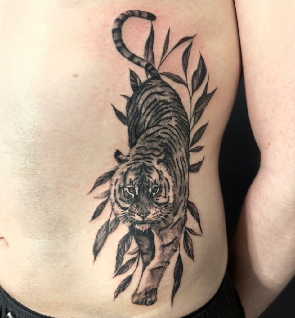Tiger tattoo located on the rib illustrative style