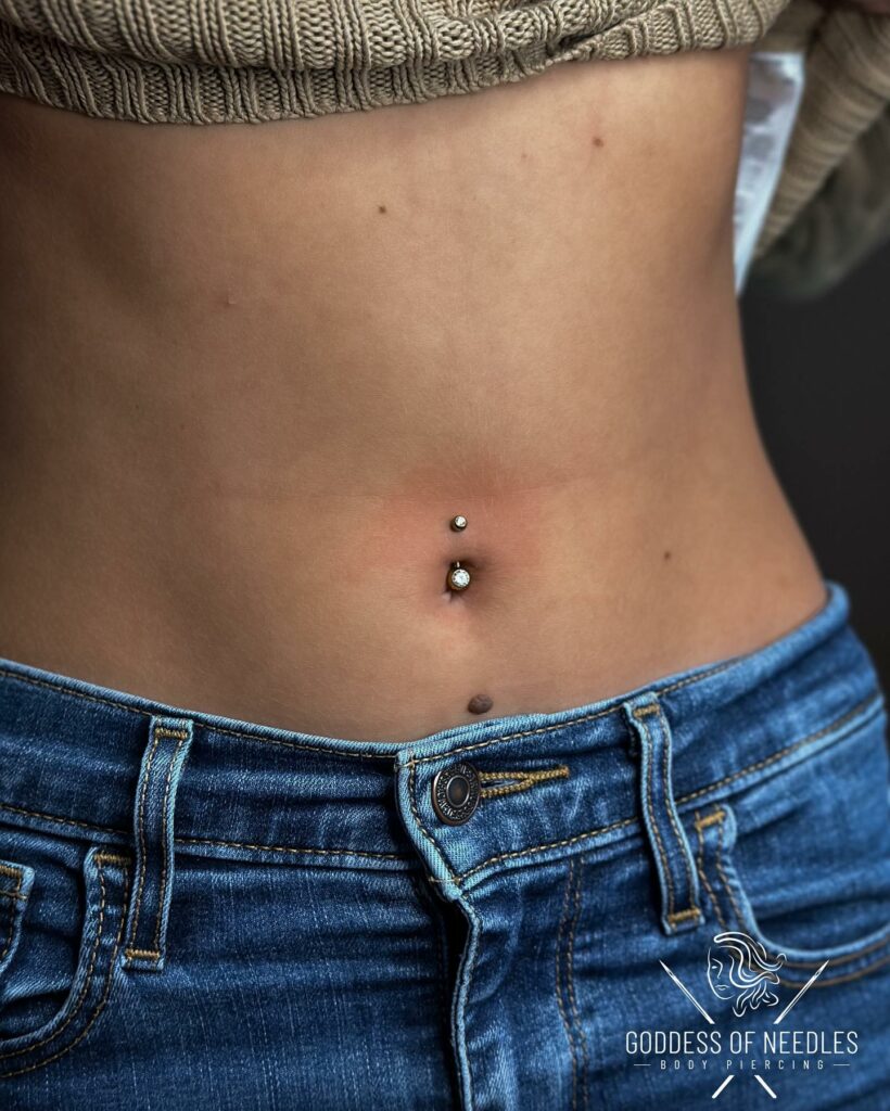 Dark skin around on sale belly button piercing