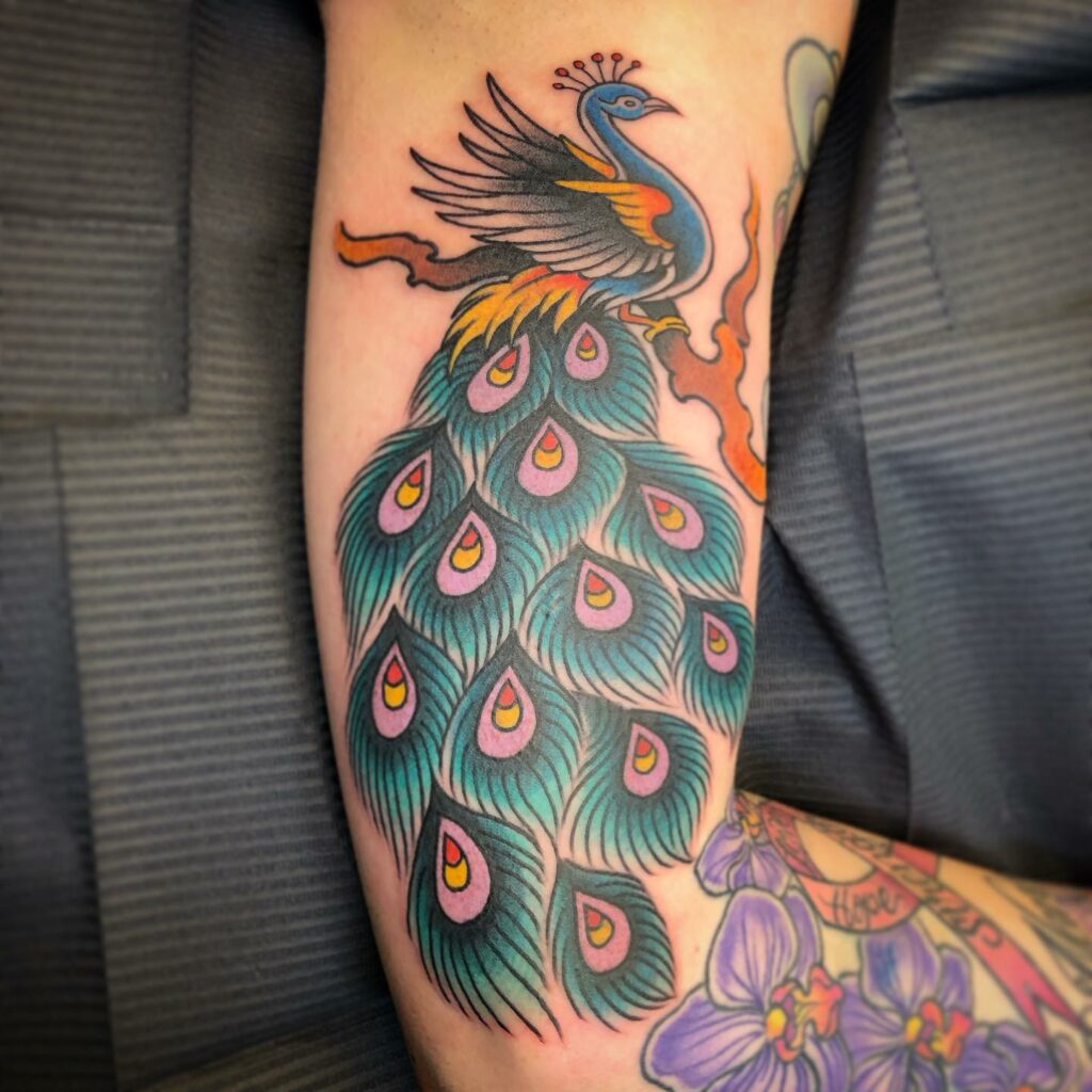 Top 10 Peacock Tattoo Designs + Meanings In 2024