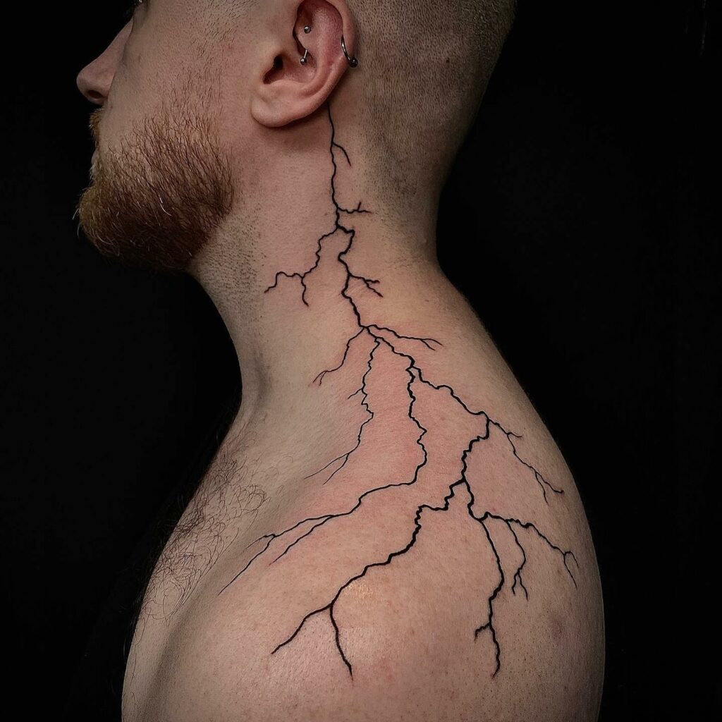 Realistic lightning striking shoulder tattoo design